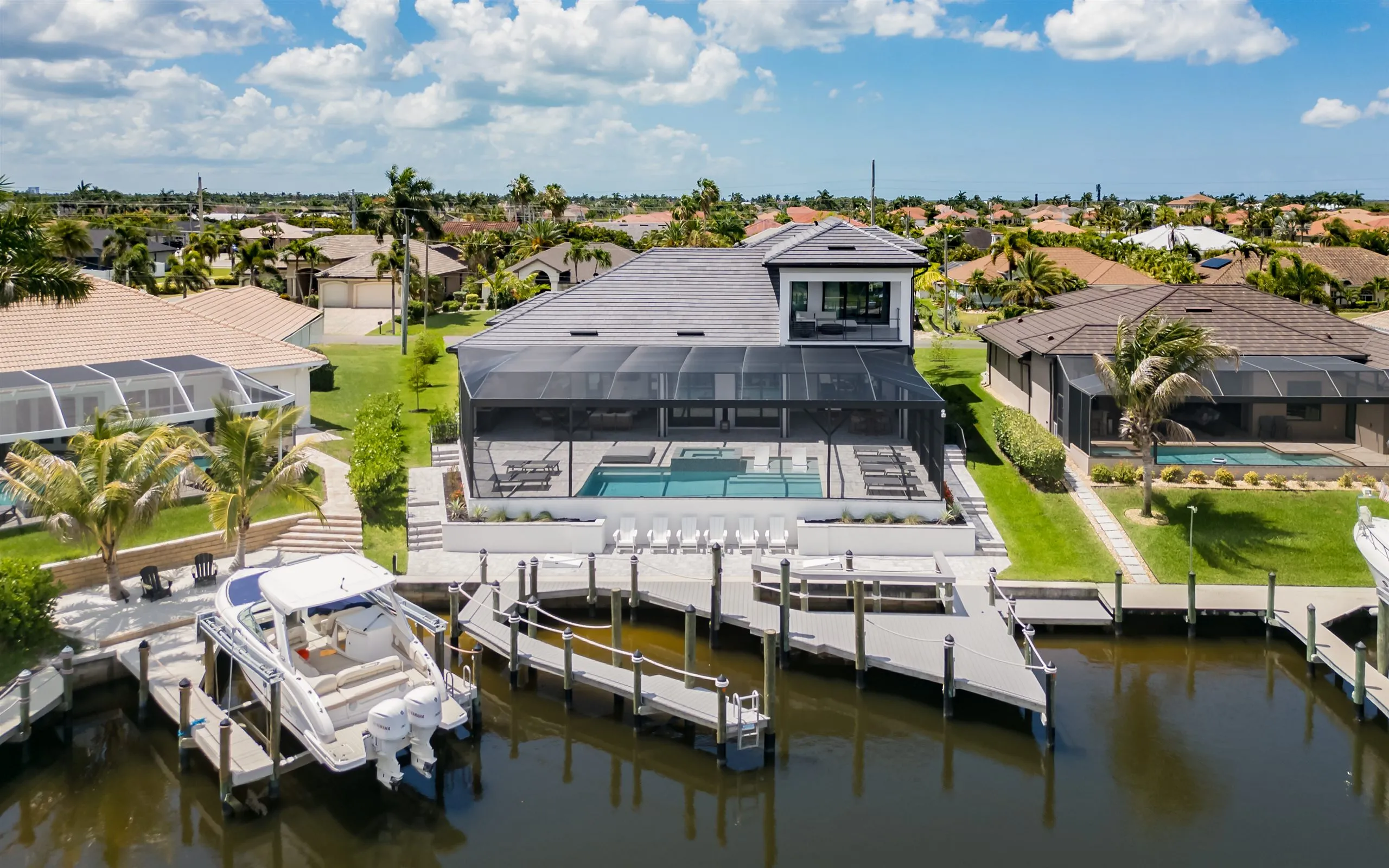 Aerial view of the private dock and Gulf-access canal at Villa Sauvage