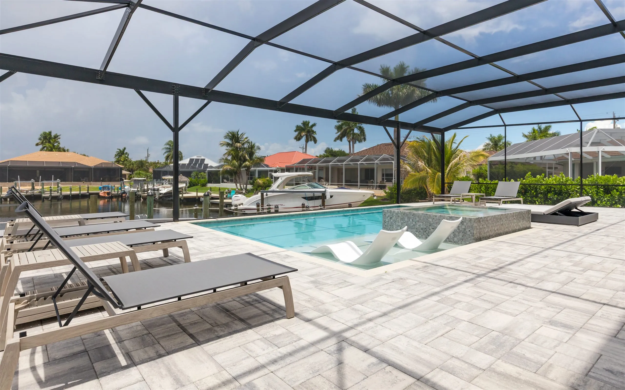 The heated pool and spa inside the screened lanai at Villa Sauvage